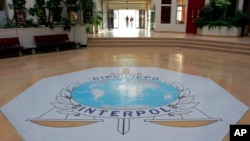 FILE - The entrance hall of Interpol's headquarters in Lyon, central France. 