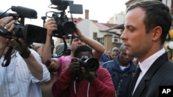 Oscar Pistorius leaves the high court in Pretoria, South Africa, Aug. 8, 2014.
