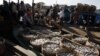 Baskets are seen loaded with fish on wooden boats at the Tonle Sap lake in Kampong Chhnang province northwest of Phnom Penh, Cambodia, December 22, 2010. 