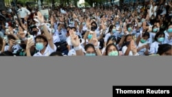 File - Anti-government protesters and students attend a demonstration in Bangkok.