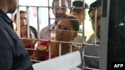 A woman, whose name is left off of the National Register of Citizens (NRC) draft, stands in a a line to collect forms to file appeals at a NRC Sewa Kendra (NSK) in Guwahati, Aug. 11, 2018.