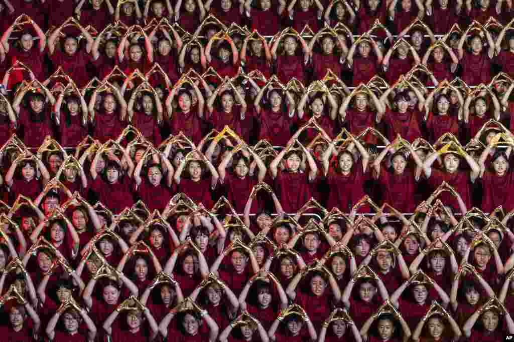 Participants attend the chorus performance as part of the celebration of the national day in Hong Kong.