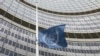 A flag is set to half mast in front of the International Atomic Energy Agency (IAEA) building in Vienna, Austria, Monday, July 22, 2019. The IAEA announced the death of the agency's Director General Yukiya Amano at the age of 72 years. (AP Photo…