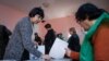 People vote at a polling station during the presidential election in Tbilisi, Georgia, Oct. 28, 2018.