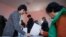 People vote at a polling station during the presidential election in Tbilisi, Georgia, Oct. 28, 2018.