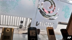 A Zain store displays mobile phones in the Kenyan capital Nairobi. Indian telecoms tycoon Sunil Bharti Mittal announced it had sealed the agreement to buy most of Zain's African assets 31 Mar 2010