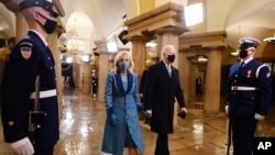 President-elect Joe Biden and his wife Jill arrive in the Crypt of the U.S. Capitol ahead of Joe Biden's inauguration Wednesday, Jan. 20, 2021, in Washington.(Jim Lo Scalzo/Pool Photo via AP)