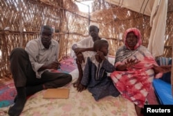 FILE - Mohammed Ahemd Al Haj, 37, who fled the conflict in Geneina, in Sudan's Darfur region, recounts how he collected bodies of people who were killed by the Rapid Support Forces (RSF) to bury them, during an interview inside a makeshift shelter in Adre, Chad August 1, 2023.