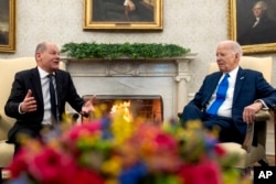 FILE - German Chancellor Olaf Scholz meets with President Joe Biden in Washington, Feb. 9, 2024. During Biden's state trip to Germany this week, the two will discuss increased reports of antisemitic acts in both countries over the last year.