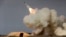 FILE - A long-range S-200 missile is fired in a military drill in the port city of Bushehr, on the northern coast of Persian Gulf, Iran, Dec. 29, 2016. President Donald Trump's national security adviser, Michael Flynn, has said the U.S. is "putting Iran on notice" after it test-fired a ballistic missile.