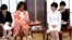 U.S. first lady Michelle Obama, center left, and Japanese counterpart Akie Abe, center right, talk with participants during the roundtable meeting as part of Japan-U.S. Joint Girls Education event at Iikura Guest House in Tokyo, March 19, 2015.