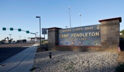 FILE - This Nov. 13, 2013 file photo shows the main gate of Camp Pendleton Marine Base at Camp Pendleton, Calif.