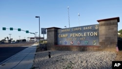 FILE - This Nov. 13, 2013 file photo shows the main gate of Camp Pendleton Marine Base at Camp Pendleton, Calif. 