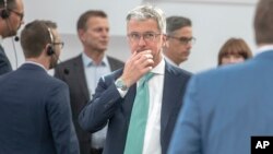 FILE - Audi CEO Rupert Stadler arrives for the annual shareholders meeting in Ingolstadt, May 9, 2018. (Armin Weigel/dpa via AP)