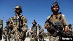 FILE - Afghan Special Forces stand during a graduation ceremony in Kabul, Afghanistan.