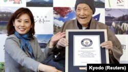 Masazo Nonaka, who was born 112 years and 259 days ago, receives a Guinness World Records certificate naming him the world's oldest man during a ceremony in Ashoro, on Japan's northern island of Hokkaido, April 10, 2018.