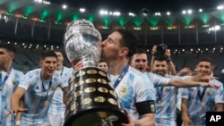 FILE: Lionel Messi kisses the trophy after Argentina beat Brazil 1-0 in the Copa America final soccer match at Maracana stadium in Rio de Janeiro, Brazil, July 10, 2021. Messi announced he was joining Inter Miami onJune 7, 2023. The rteam says he will debut July 21.