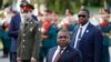 President of Mozambique Filipe Nyusi, centre, attends a wreath laying ceremony at the Tomb of the Unknown Soldier in Moscow, Russia, Wednesday, Aug. 21, 2019.