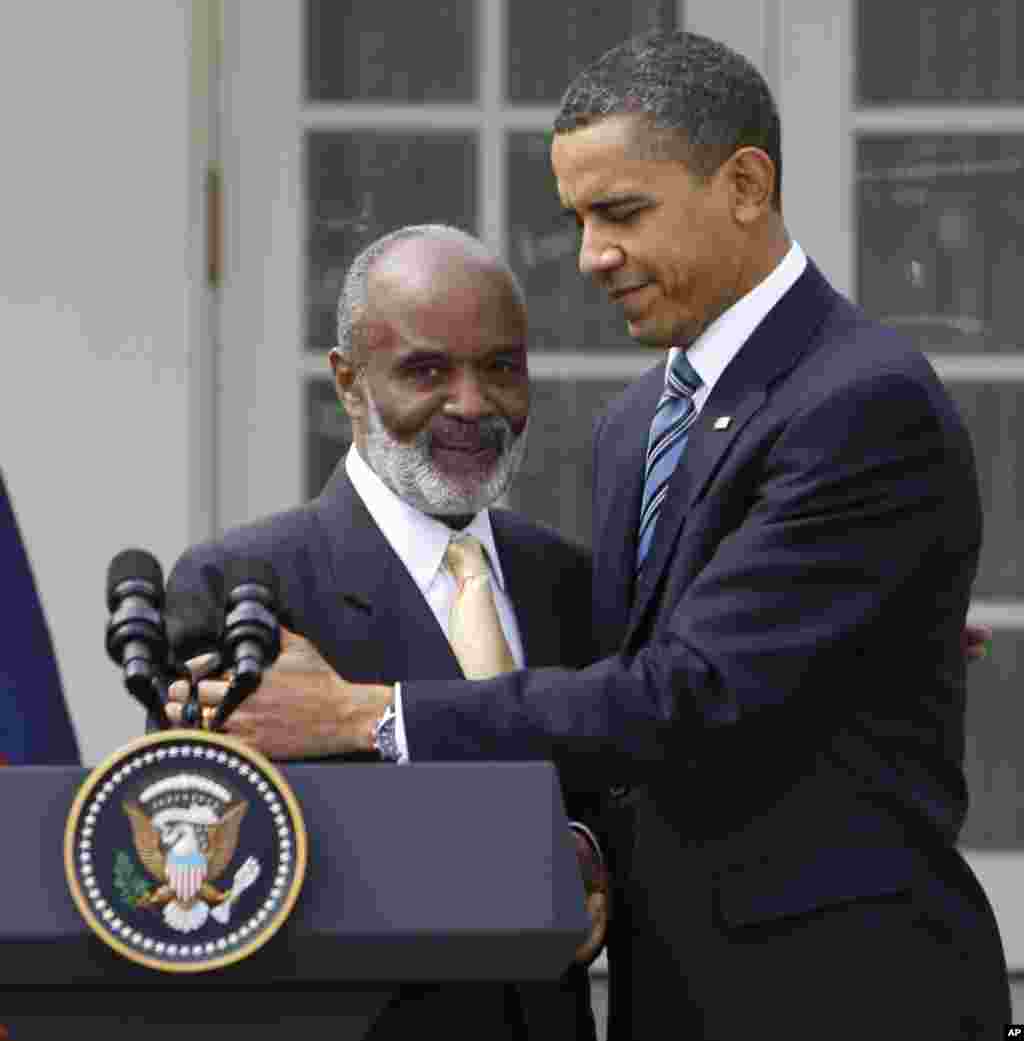 President Barack Obama embraces Haitian President Rene Preval in the Rose Garden of the White House in Washington Wednesday, March 10, 2010. (AP Photo/Alex Brandon)