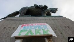 A sign saying Heather Heyer Park is placed at the base of the statue of Confederate Gen. Robert E. Lee in Emancipation Park in Charlottesville, Va., Aug. 18, 2017. Heyer was killed while protesting a white nationalist rally in Charlottesville Aug. 12. 