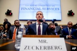 FILE - Facebook CEO Mark Zuckerberg arrives for a House Financial Services Committee hearing on Capitol Hill in Washington, Oct. 23, 2019.