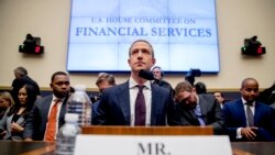 FILE - Facebook CEO Mark Zuckerberg arrives for a House Financial Services Committee hearing on Capitol Hill in Washington, Oct. 23, 2019.