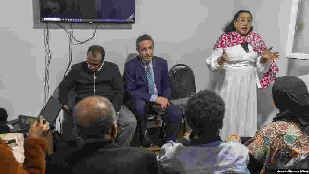 Sudanese professional Seham Ali, right, explains Egypt’s new asylum bill with Egyptian lawyer and office head Yasser Farage, center, in Cairo on Nov. 11, 2024. Rights groups warn the bill “violates” and “undermines basic protections for refugees.”