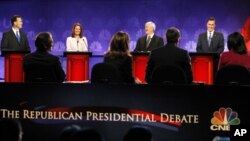 Republican presidential candidates (L-R) Rick Santorum, Michele Bachmann, Newt Gingrich and Mitt Romney take part in the CNBC Republican presidential debate in Rochester, Michigan, November 9, 2011.