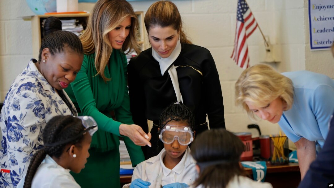 From left, school Principle Dana Bogle, first lady Melania Trump, Queen Rania of Jordan and Education Secretary Betsy DeVos talk with students during a science class at the Excel Academy Public Charter school in Washington, April 5, 2017.