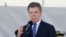 Colombian President Juan Manuel Santos gives a speech during a ceremony to mark the 94th anniversary of the Colombian Air Force at a military base in Bogota, Nov. 8, 2013