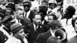 (FILE) Dr. Martin Luther King Jr. leads a civil rights march in Boston, April, 1965.