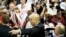 Republican presidential candidate Donald Trump gestures as signs autographs at a campaign event in Atlanta, Feb. 21, 2016.