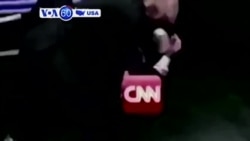 VOA60 America - President Trump tweets a doctored, 10-year old wrestling video that shows him tackling and punching a figure labeled CNN