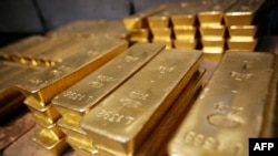 FILE - Gold bars are pictured on April 6, 2009 at a plant of gold refiner and bar manufacturer Argor-Heraeus SA in Mendrisio, southern Switzerland.