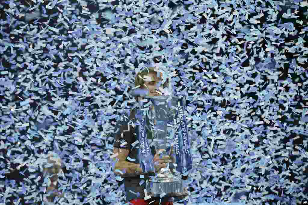 Alexander Zverev of Germany holds the trophy after defeating Novak Djokovic of Serbia in their ATP World Tour Finals singles final tennis match at the O2 Arena in London on November 18, 2018.