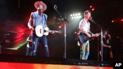 Brian Kelley, left, and Tyler Hubbard of Florida Georgia Line perform at the 2018 CMA Music Festival in Nashville, Tennessee, June 10, 2018.