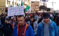 FILE - Algerians march in an anti-government demonstration in the Algerian city of Bordjab Bou Arreridj, on Feb. 14, 2020.