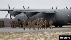 Denmark's troops for NATO Enhanced Forward Presence battle group arrive at Amari, Estonia, Jan. 10, 2018. The soldiers join British troops alongside tanks, armored vehicles and artillery.