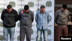 Colombian police present to the media four gang members connected to the death of US drug enforcement agent James 'Terry' Watson, in Bogota in this June 26, 2013, file photo.