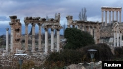 FILE - People walk near the Roman ruins of Baalbek, Lebanon, Jan. 5, 2024.