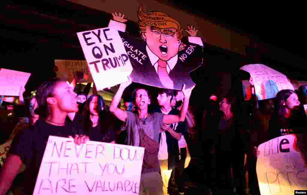 People protest against U.S. President-elect Donald Trump in Miami, Florida, Nov. 11, 2016. 
