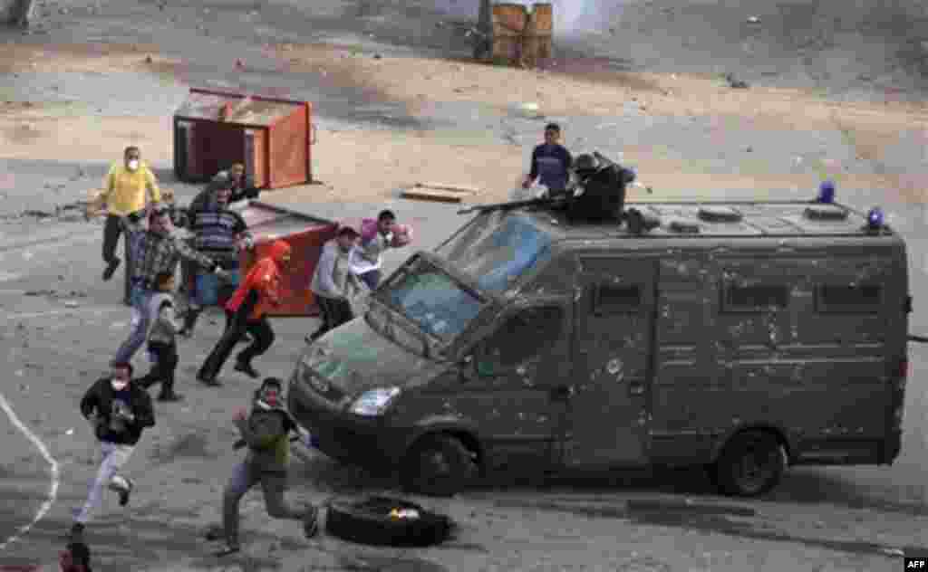Egyptian protesters clash with riot police in Suez, Egypt Thursday, Jan. 27, 2011. Egyptian activists protested for a third day as social networking sites called for a mass rally in the capital Cairo after Friday prayers, keeping up the momentum of the co