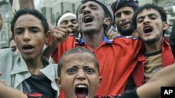 Anti-government protesters, shout slogans during a demonstration demanding the resignation of Yemeni President Ali Abdullah Saleh, in Sana'a, Yemen, July 5, 2011