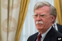 FILE - U.S. President Donald Trump's National Security Adviser John Bolton waits for the begenning of talks with Russian President Vladimir Putin in the Kremlin in Moscow, Russia, June 27, 2018.