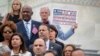 FILE - Rep. Earl Blumenauer, D-Ore., holds a sign as House Democrats gather on the steps of the Capitol to call for passage of the Keep Families Together Act, legislation to end the Trump administration's policy of separating families at the US-Mexico border, in Washington, June 20, 2018. 