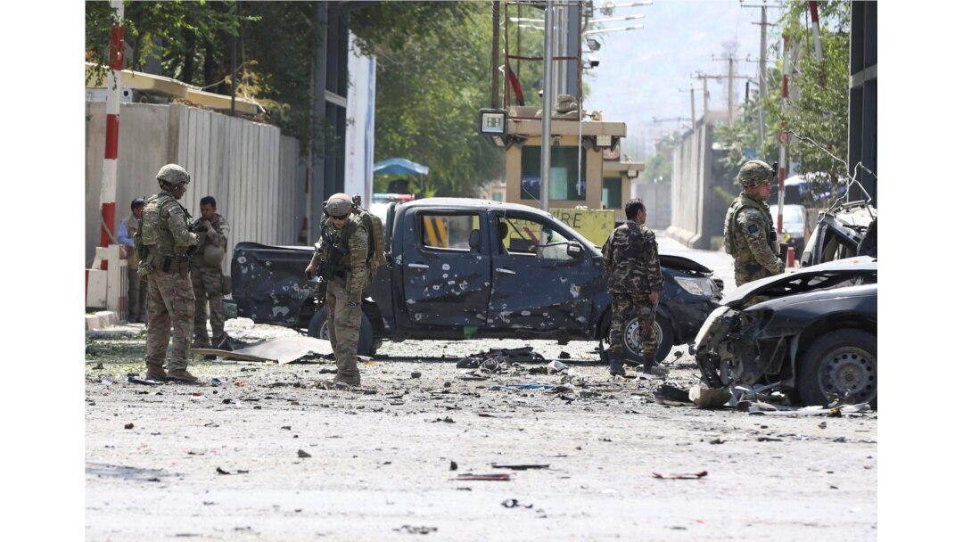 Foreign troops with NATO-led Resolute Support Mission investigate at the site of a suicide attack in Kabul, Afghanistan, Sept. 5, 2019.