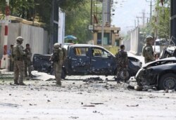 Foreign troops with NATO-led Resolute Support Mission investigate at the site of a suicide attack in Kabul, Afghanistan, Sept. 5, 2019.