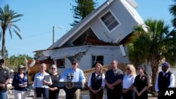 President Joe Biden speaks following a briefing by federal, state, and local officials in St. Pete Beach, Florida, during a tour of areas affected by Hurricane Milton, Oct. 13, 2024. 