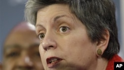 Janet Napolitano, right, Secretary of the Department of Homeland Security, answers a reporter's question during an NFL Super Bowl Security news conference in Dallas, Texas, January 31, 2011