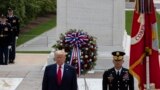 President Donald Trump stands after placing a wreath at the Tomb of the Unknown Soldier in Arlington National Cemetery, in honor of Memorial Day, Monday, May 25, 2020, in Arlington, Va. (AP Photo/Alex Brandon)